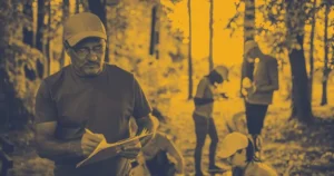 How to Become A Nonprofit Event Planner Volunteer planting a tree at an outdoor event