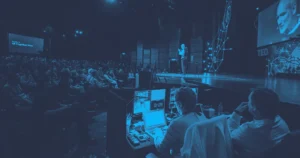 Hybrid Event Marketing Ideas for a Successful Event Conference audience facing the main stage