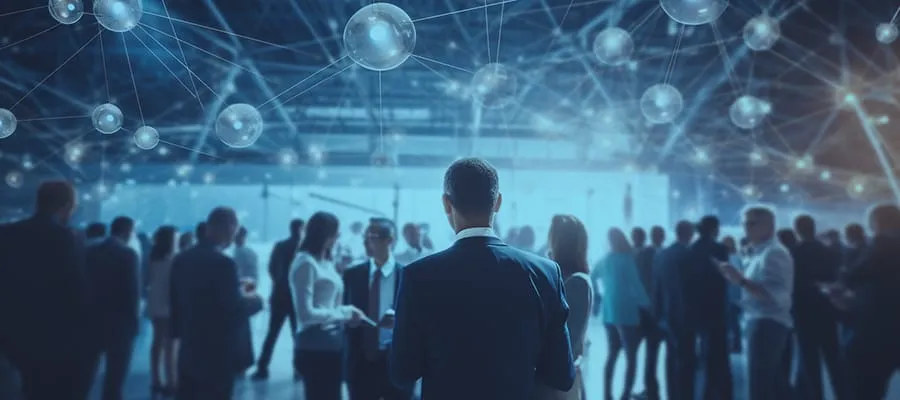 A group of people gathered during an event, with digital lines connecting over their heads, symbolizing the idea of networking and connection