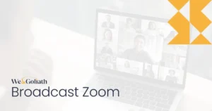 Webinar Wonders: How to Broadcast Zoom Meetings with Ease A laptop prominently displaying the words "broadcast zoom" on its surface.