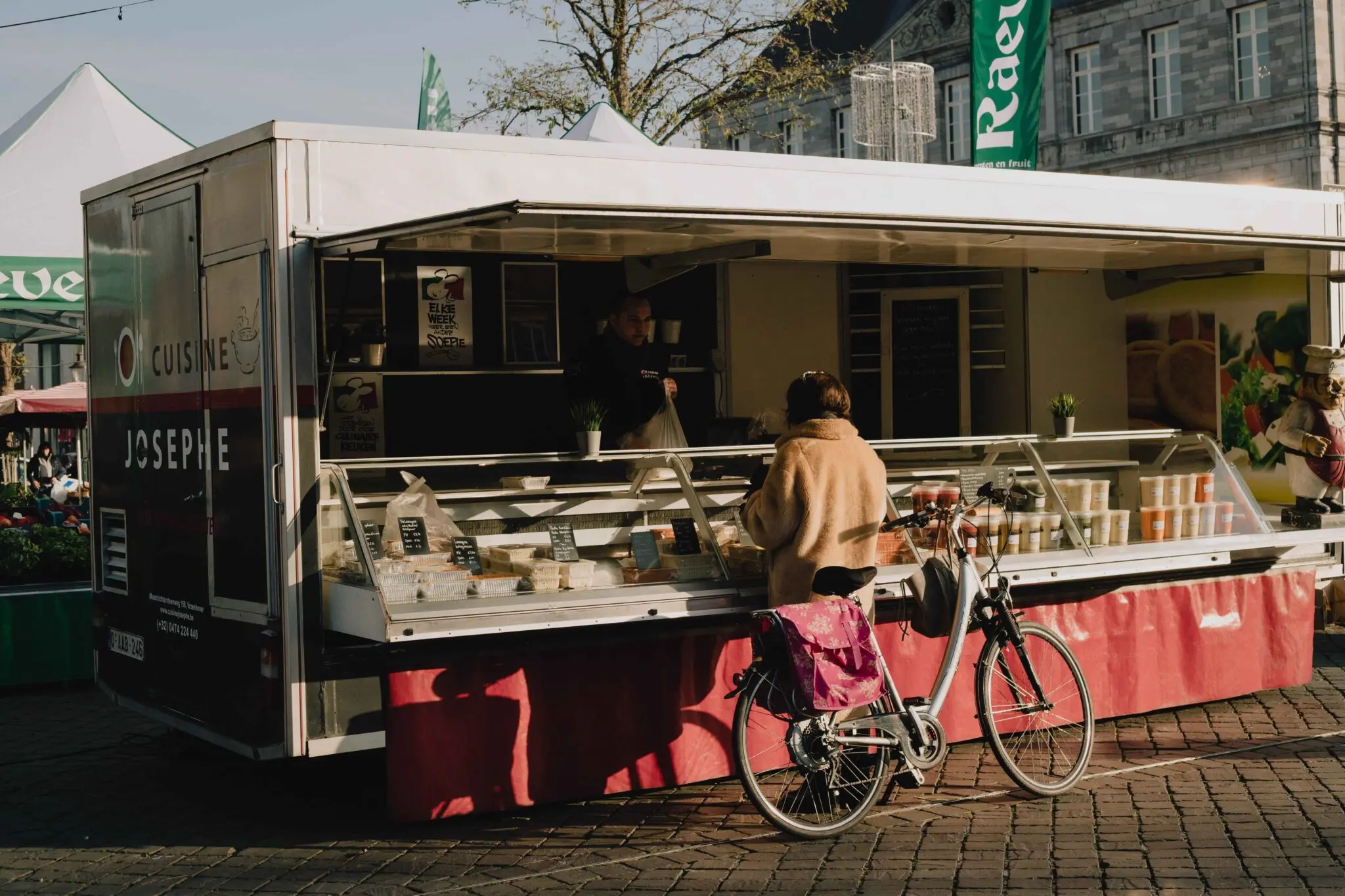 Food truck serving customers on a street