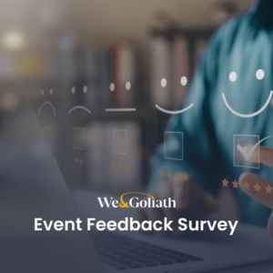 A man with a smiley face holding a laptop with the words event feedback survey.