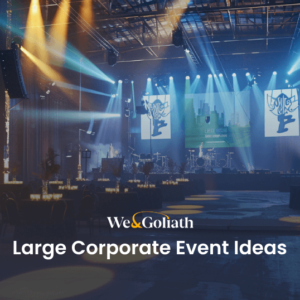 9 Extravagant Large Corporate Event Ideas for Big Budgets Corporate event venue with stage setup and banquet tables under blue lighting.