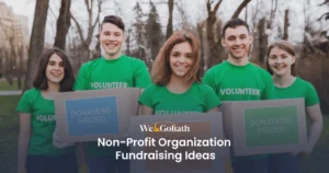 30 Fundraising Ideas for Non Profit Organizations Group of smiling volunteers holding signs for donations and fundraising.