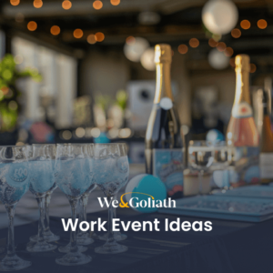 Uplifting Work Event Ideas for a Positive Work Culture Elegant corporate event setup with champagne glasses and appetizers on a table, with "work event ideas" text overlay.
