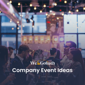 Group of professionals networking at an indoor company event with ambient lighting and modern decor.