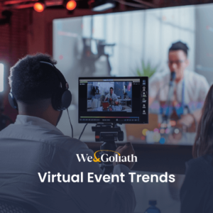 People wearing headphones attending a virtual event shown on a screen, with text overlay "we&goliath virtual event trends".