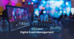 Digital Event Management: Planning and Execution A computer on a desk displays a digital event setup with colorful lights in the background. Text reads "We & Goliath Digital Event Management.