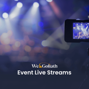 How to Live Stream Your Event: Pro Tips & Tools A camera records a live event with people on stage, with "We and Goliath Event Live Streams" text overlay in the foreground.