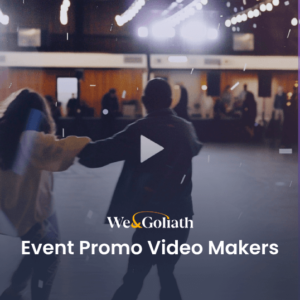 Two people are dancing in a dimly lit room with string lights overhead. Text on the image reads, “We & Goliath - Event Promo Video Makers.” A play button icon is displayed in the center.