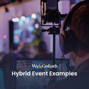 A person wearing headphones operates camera equipment in a dimly lit setting with blurred figures and screens in the background. Text overlay reads: "We & Goliath Hybrid Event Examples.
