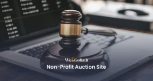 Top Non-Profit Auction Platforms to Boost Your Fundraising Efforts A judge's gavel resting on a laptop keyboard with the text "We & Goliath Non-Profit Auction Site" displayed at the bottom.