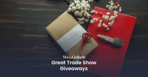Creative Trade Show Giveaway Ideas to Engage Attendees We and Goliath cover for trade show giveaways, showing wrapped gift boxes