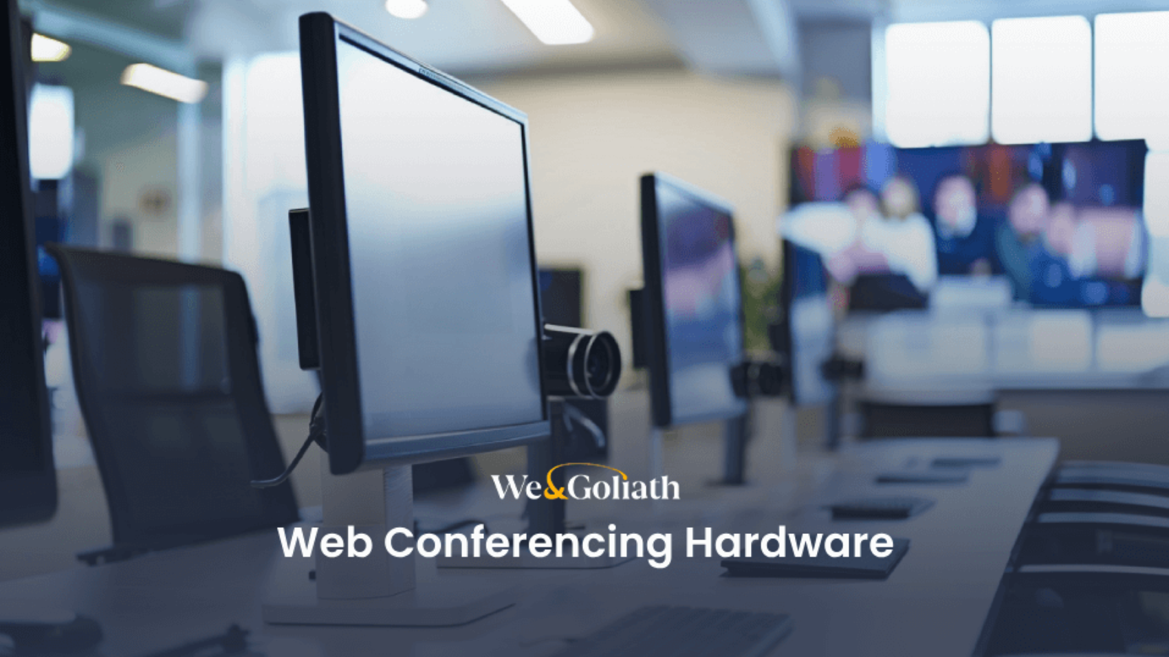 A row of computer monitors equipped with webcams is shown in an office setting. The text reads "We&Goliath Web Conferencing Hardware.