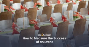 Evaluating Event Effectiveness: Metrics and Insights Rows of tables set for an event with charming flowers, elegant menus, and neatly folded napkins create the perfect setting. Explore "How to Measure the Success of an Event" to ensure every detail contributes to an unforgettable experience.
