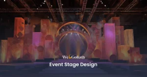 Set Design Tips to Enhance Your Event Stage We and Goliath cover for event stage design, showing a pastel-lit stage set