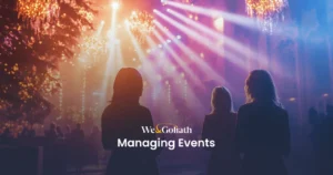 Exploring the World of Event Management Silhouettes of three people face vibrant stage lights at an event, with "We & Goliath Seamlessly Managing Events" text overlay.