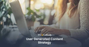 Crafting an Effective Strategy for Audience-Generated Content We and Goliath cover for a user-generated content strategy, showing a person at a laptop