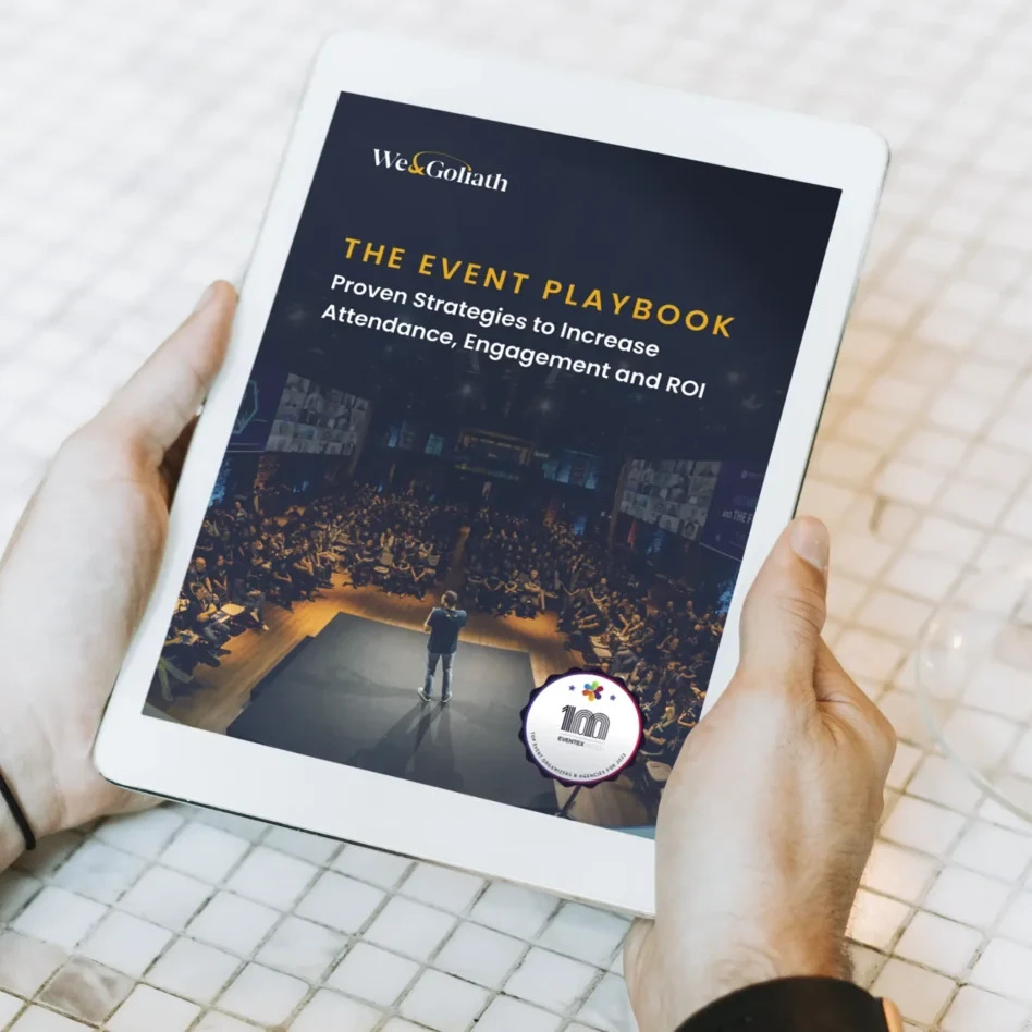 Reading The Event Playbook on a tablet over coffee