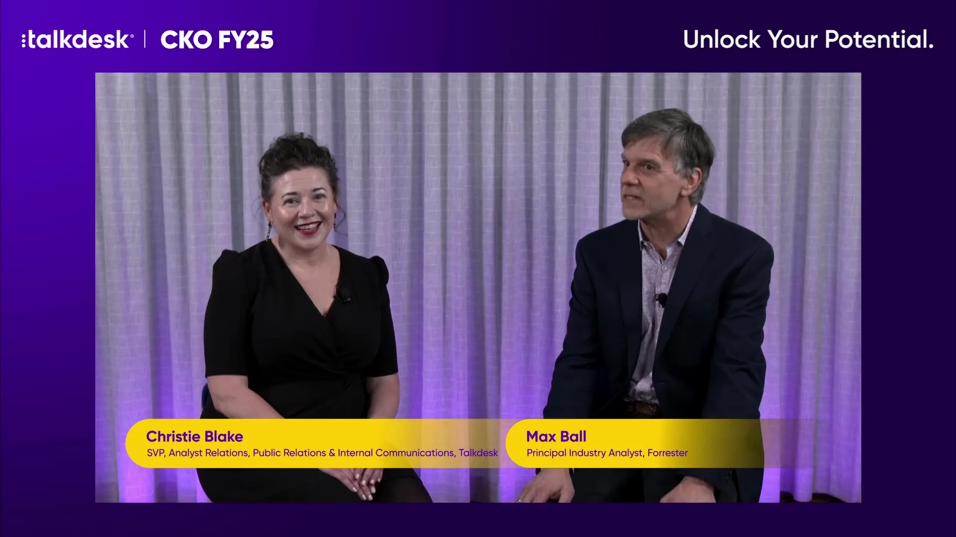 A two-camera fireside chat from the Talkdesk CKO FY25 broadcast, with branded lower thirds for both speakers